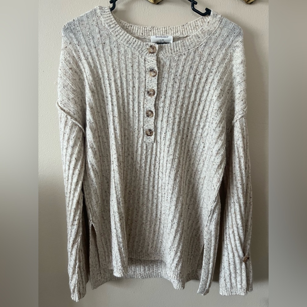 Oatmeal colored knit sweater with front button detailed and sleeve detailing